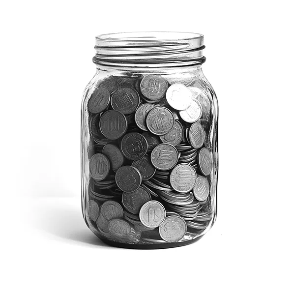 Glass jar filled with vintage coins
